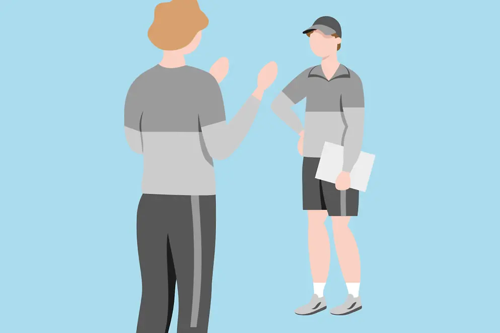 Trainer in einem Gespräch